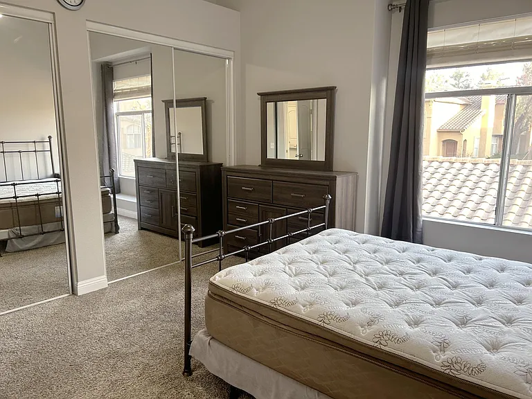 2nd Master Bedroom features two more mirrored closets with tons of storage space. Furnished with two pristine dressers, a nightstand, and bed. Can remove furniture as needed. Ceiling fan and light are on a switch. Ethernet connections in wall connect to t