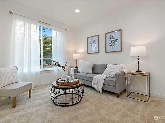 Lovely formal living room with fabulous natural light.>