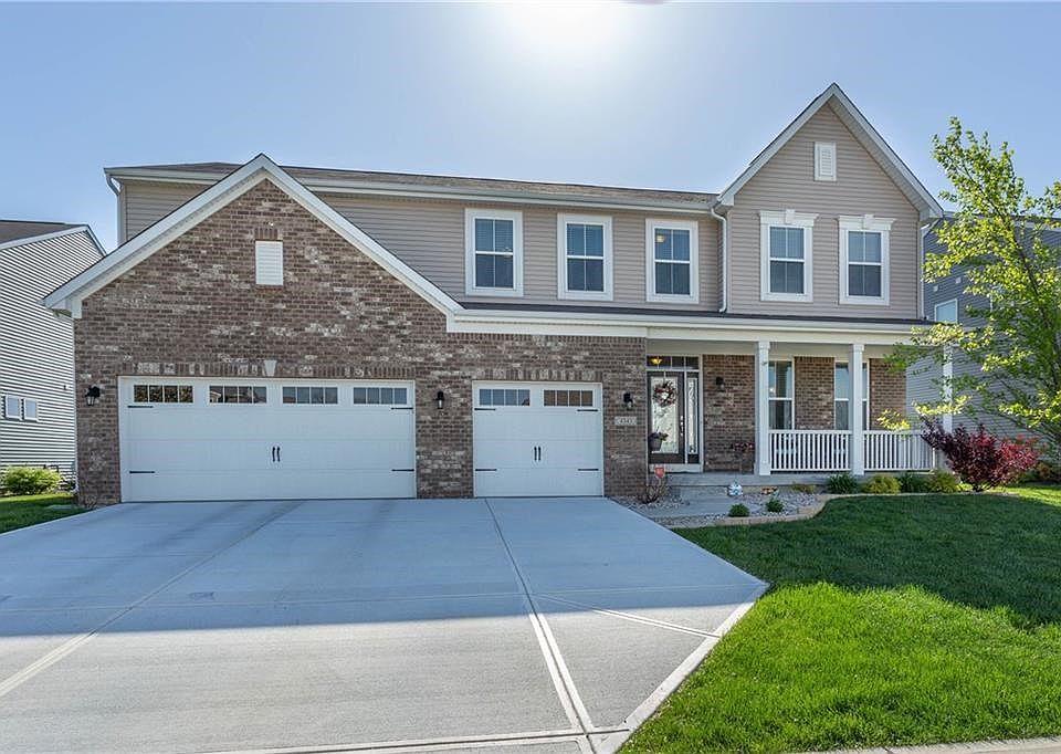 Beautiful curb appeal w/brand new driveway!  You've always wanted a front porch!  3rd car garage for all your extra "stuff"!