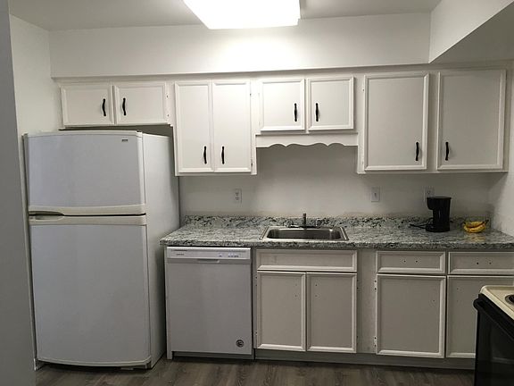 Updated kitchen. Bottom handles are on but I need to post a new picture. New dishwasher. New countertop and sink and bottom cabinets.