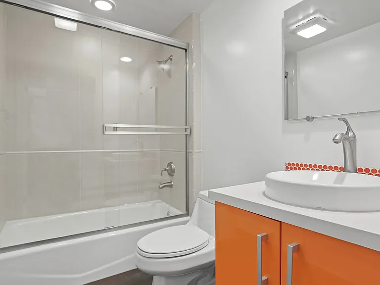 Bright Bathroom with Full-Size Bathtub