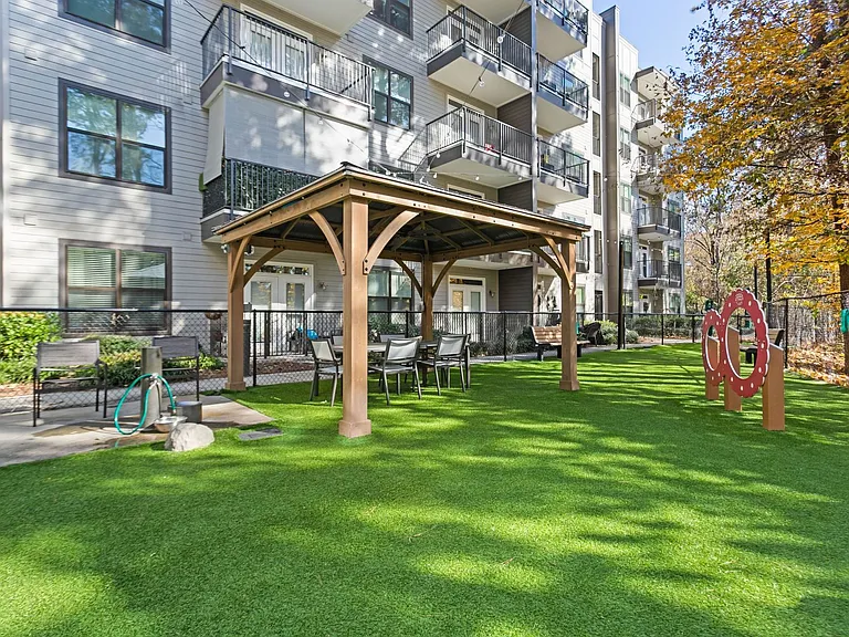 Covered pergola with seating for you to relax while pups play