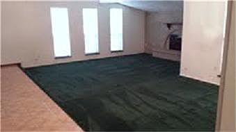 Large Living Room with Wood burning fireplace and adjoining dining room.