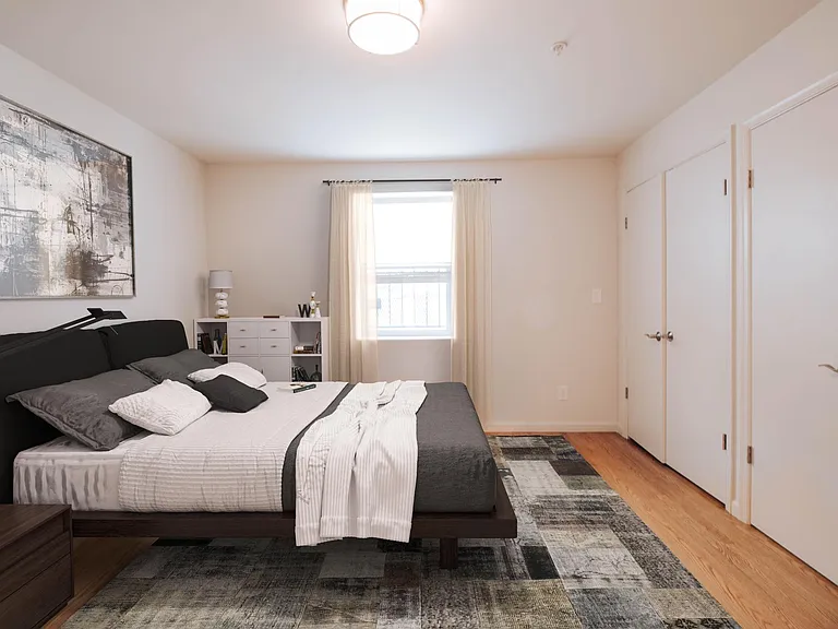 Large master with attached bathroom and wall full of closets!
