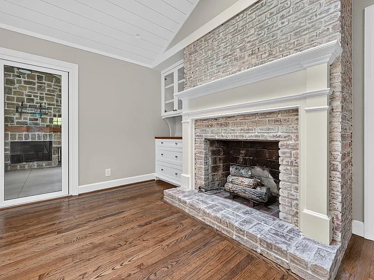 Gas fireplace w/perfect bar set up next to it on the left.