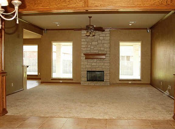 Spacious Living Room with Fireplace and Oak Trim