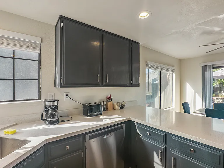 Enjoy cooking in the upgraded kitchen, complete with sleek granite countertops and a full suite of stainless steel appliances, including a refrigerator, range, microwave, and dishwasher.