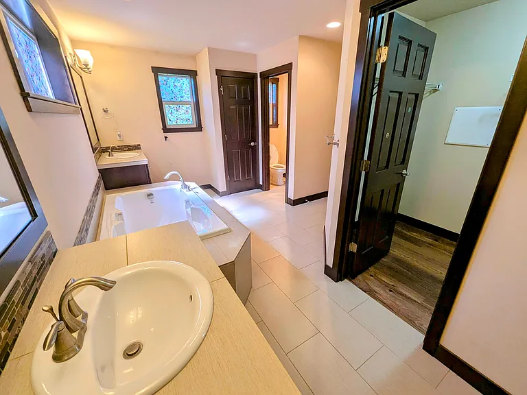 Toilet with its own door, and WIC in master bath