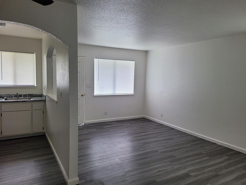 Looking into the living room/kitchen from the bedroom doorway.