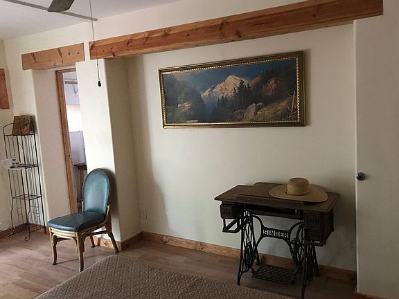 There are tall oak armories and the Singer table here now.