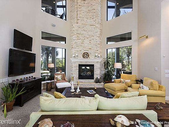 First floor living room with 55" HDTV/Blu-ray & fireplace.