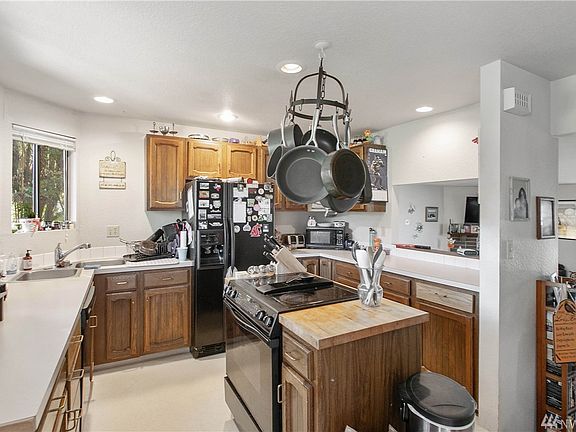 Light and bright kitchen is open to the family room with the large pass-through.  Not pictured is the spacious eating area. 