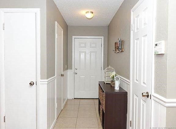 Greatroom to tiled front entry.