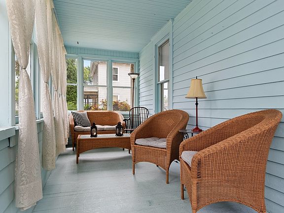 The enclosed front porch is a lovely area to read and relax and chat with friends and family.