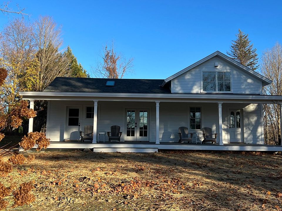 Beautiful 40 foot long porch with views of the surrounding Vermont landscape.