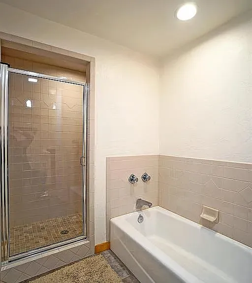 Downstairs bath tub and large walk in shower