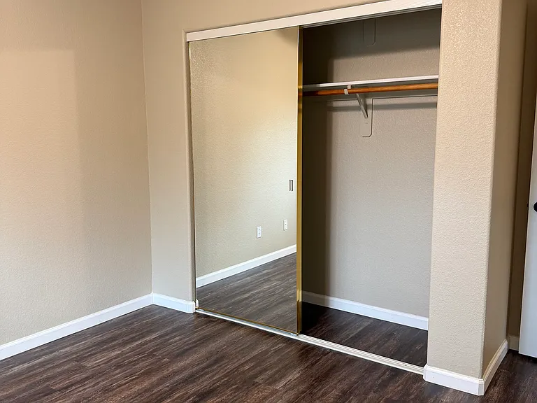 Mirrored closet in front bedroom