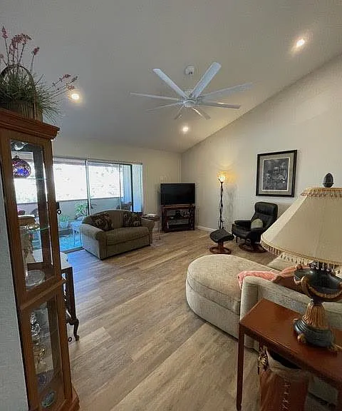 Living room, large sliding door to large balcony and storage closet.