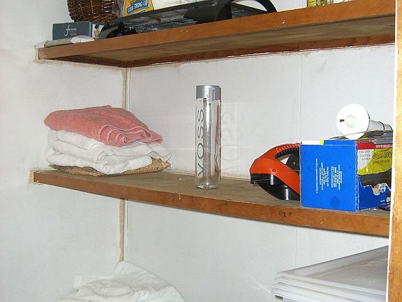 Room off kitchen has lots and lots of storage (possible walk-in pantry). 