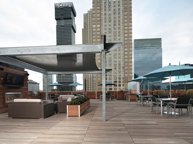 Rooftop Deck Features Lounge Area, Fireplace and Flatscreen TV
