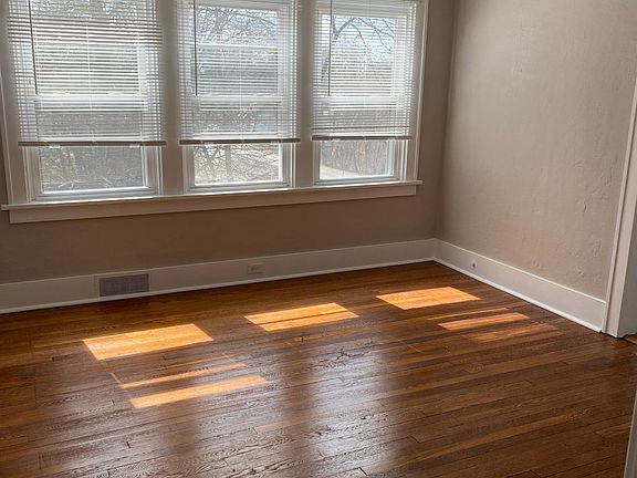 Spacious living room with easy access to kitchen
