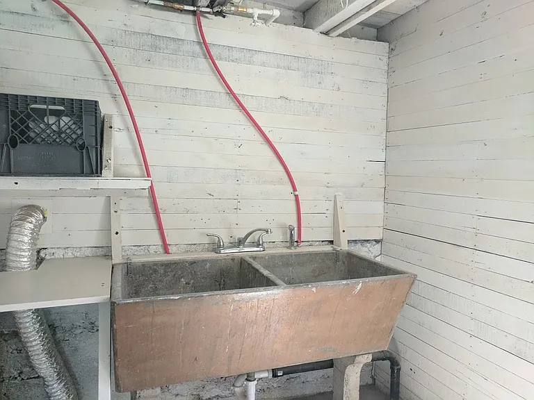 Original basement utility sink in the Laundry room