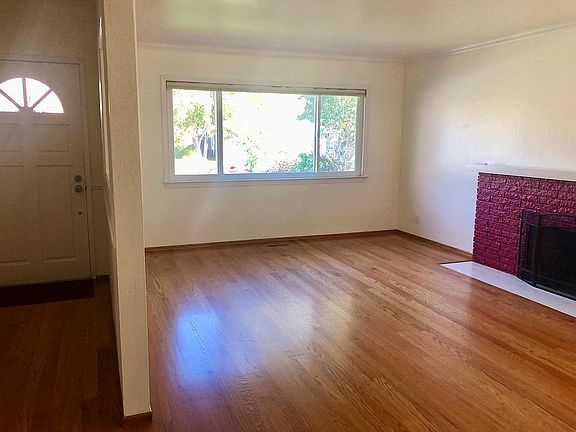 Bright and spacious living room with fireplace
