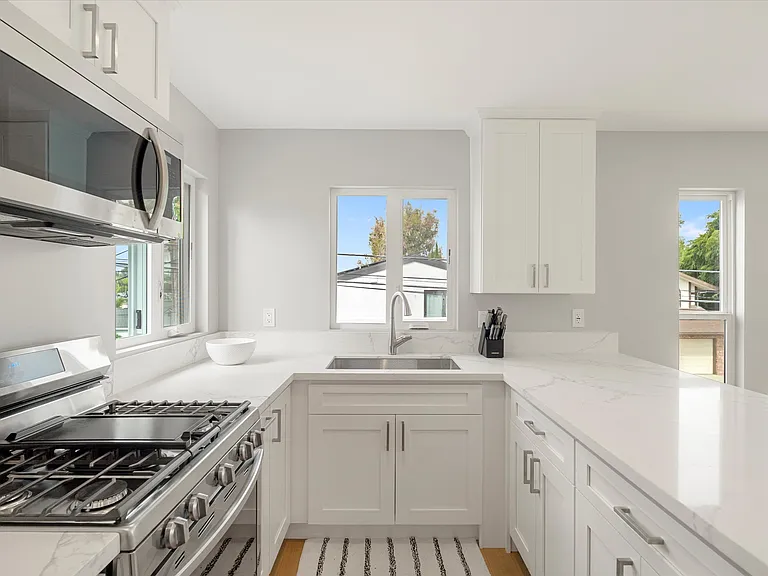 Amazing kitchen with a view of the Colorado Lagoon and Marina Vista Park as you wash your dishes