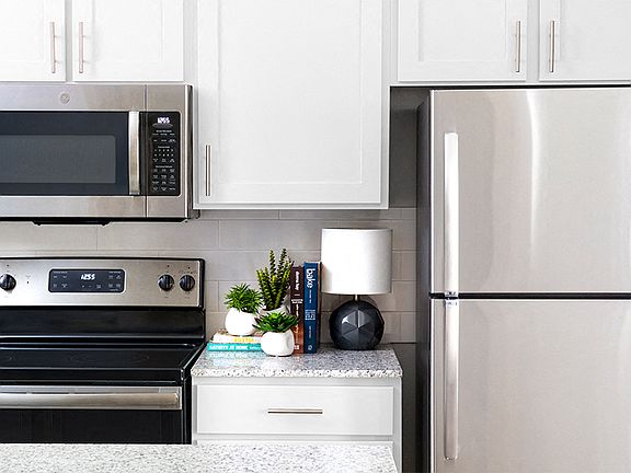 Kitchens with premium granite countertops and stainless steel appliances