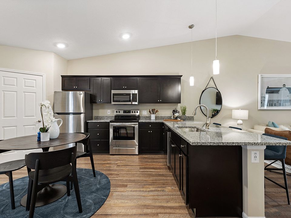 Enjoy a Spacious Kitchen, Complete with Granite Counters and a Generous Island