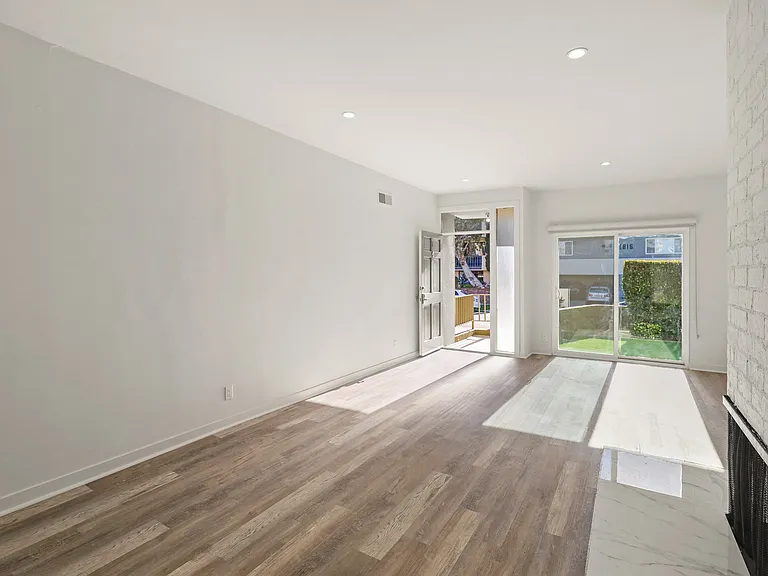Open-Concept Dining and Living Room Space with Fireplace