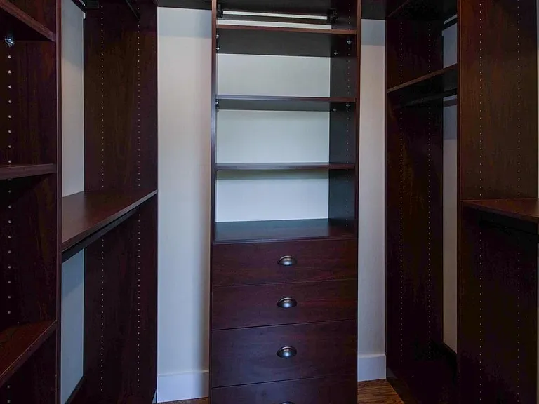Primary bedroom walk-in closet