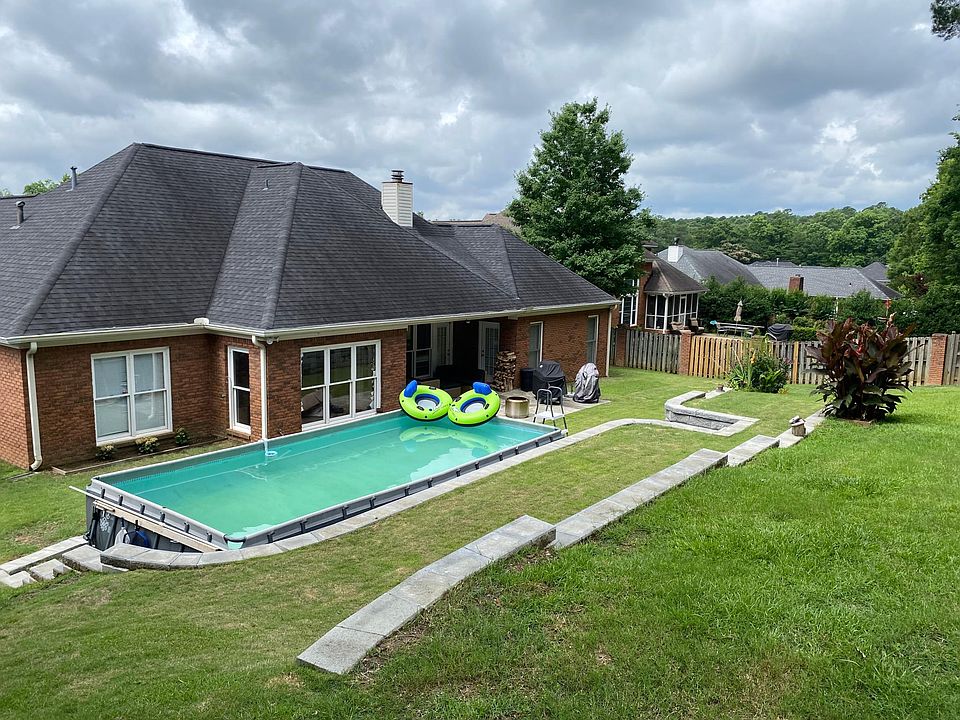 Back patio with above ground pool