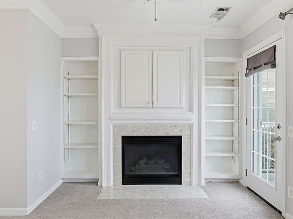 Fireplace right off the kitchen.