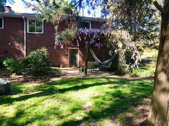 Backyard Cement Patio with Trellis from Antique Shed View