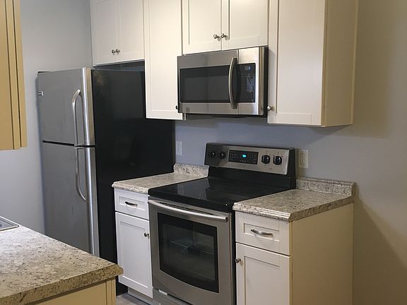 Galley Kitchen with new Stainless Appliances