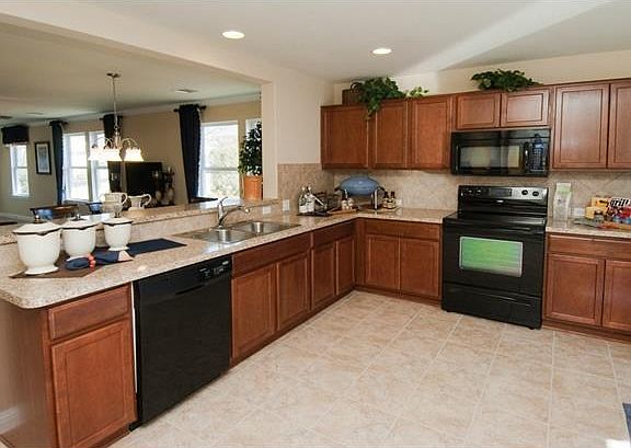 Photo of Model Home with Same Floor Plan, Not of Actual Home Lis