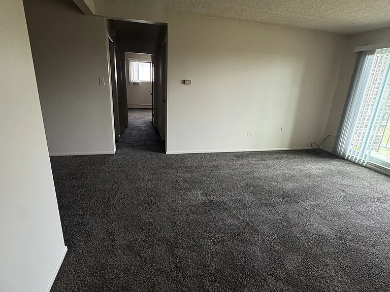 Living room with hallway to bedrooms