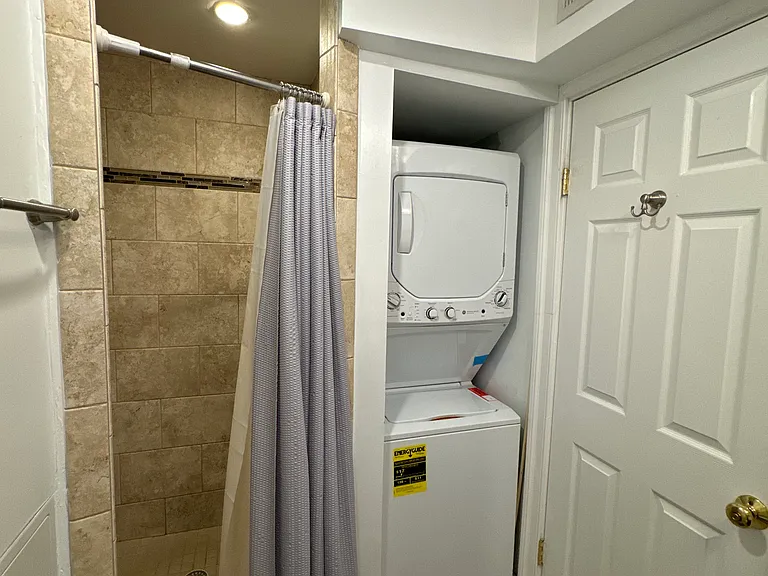 In unit washer dryer and spacious shower.