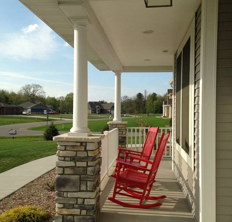 Sweet and welcoming, the front porch spans the entire length of the house!