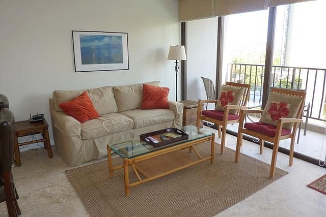 Fully furnished living area with lanai, air conditioning.
