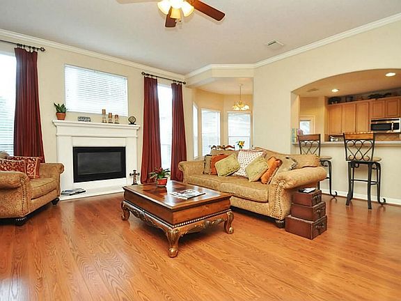The kitchen is open to the family room making it easy to lie around on the couch watching the Big Screen TV -- all while hollering to someone in the kitchen to bring you a snack!
