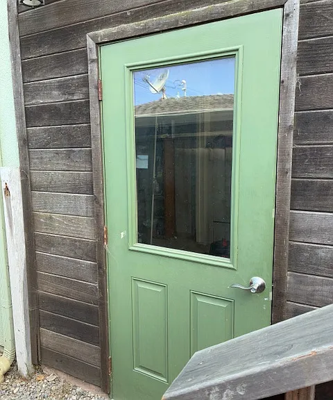 Entry way to garage and stairway to rental