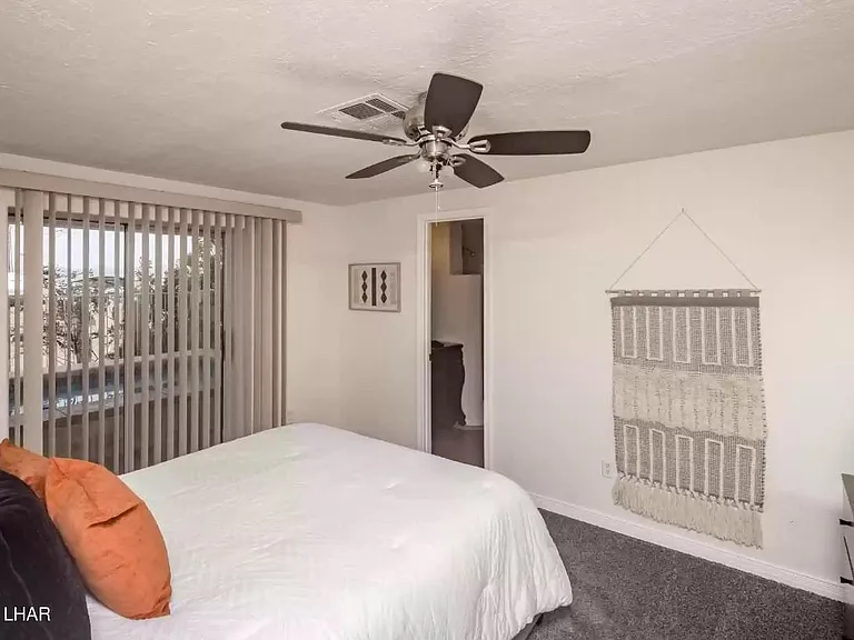 Bedroom 1 on main floor with en suite bath and queen bed.