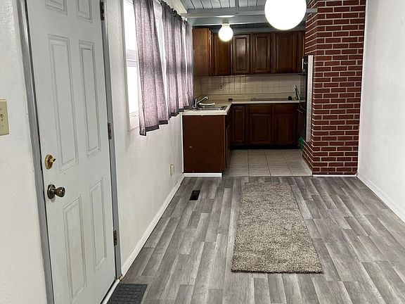 Front Door and dining area between kitchen and living room