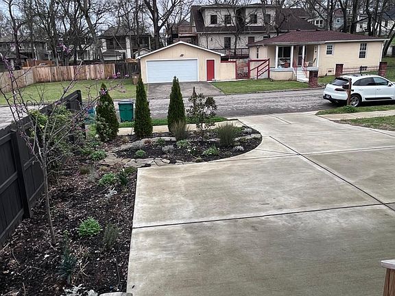 Shared driveway with parking pad in front of home