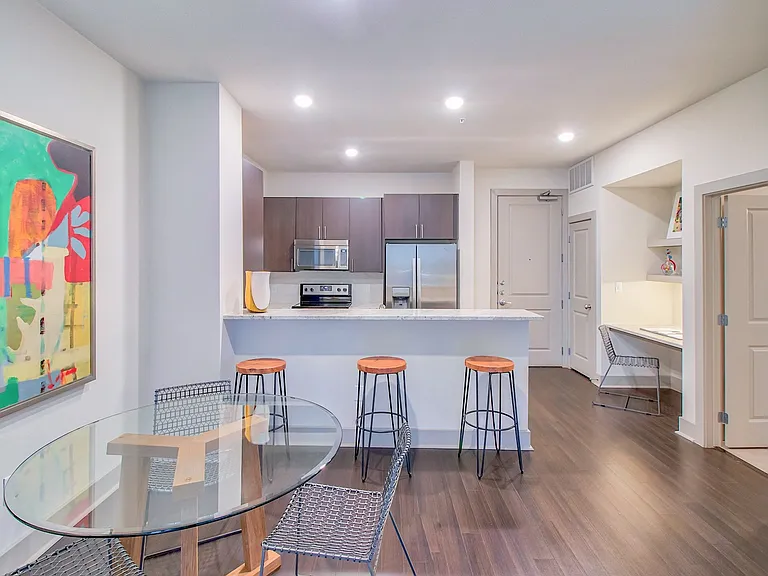 Open-concept gourmet kitchens with stainless steel appliances and custom cabinetry