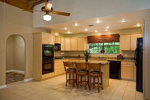 Beautiful cabinetry and slab granite countertops.