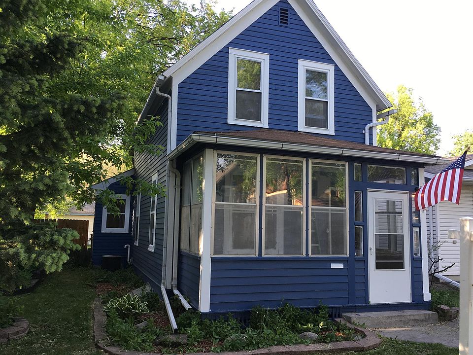 Front of home showing screened in front porch to enjoy your outdoor summer times.