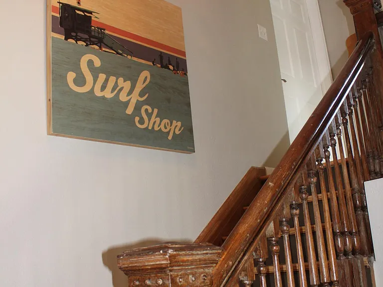 1 flight of stairs leds up to an open concept living